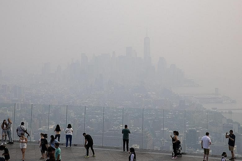 Smoke pollution from wildfires in the western United States clouding the New York City skyline on Tuesday. The city's air quality was firmly in the unhealthy range that day. PHOTO: REUTERS