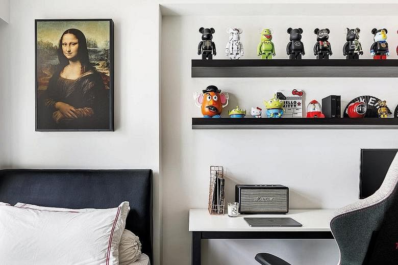 (Above) The living, dining, and dry kitchen zones are distinct yet linked for easy movement. (Left) A Mona Lisa painting and shelves of figurines mounted side by side in one of the bedrooms. (Far left) Kaws-inspired artwork hanging in the dining area