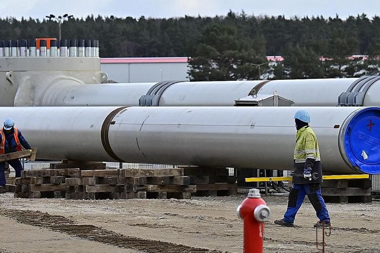Workers at the construction site of the Nord Stream 2 gas pipeline in Lubmin, north-eastern Germany, in 2019. The pipeline not only makes Germany more dependent on Russia, but also strengthens Russia's ability to put pressure on states that were once