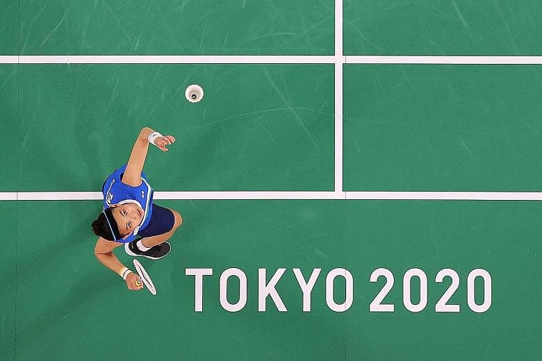 Women's world No. 1 Tai Tzu-ying leaping to smash in her opening group game against Switzerland's Sabrina Jaquet at the Tokyo Games yesterday. She won 21-7, 21-13.