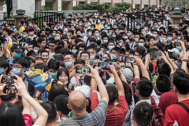 Students leaving a school in Wuhan after finishing the National College Entrance Examination last month. China's for-profit education sector has been under scrutiny as part of Beijing's push to ease pressure on school children and reduce a cost burde