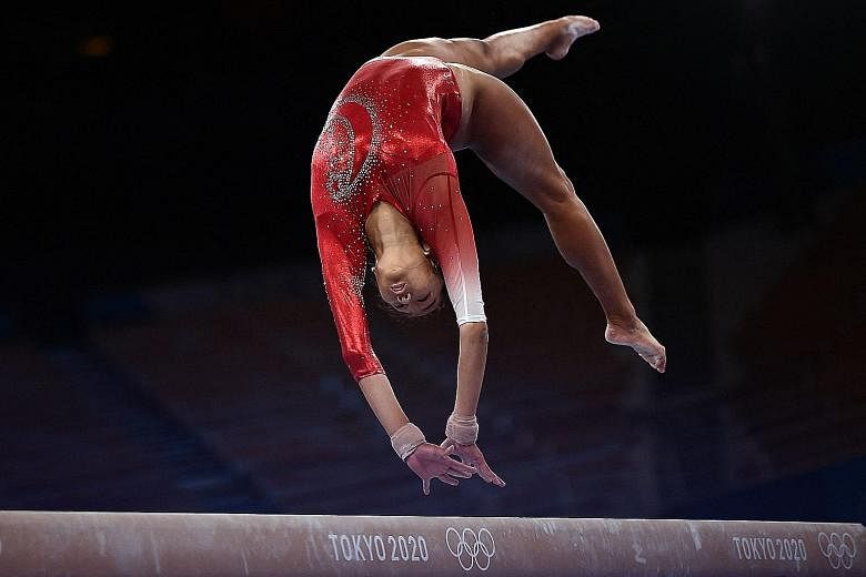 Singapore's Tan Sze En competing in the artistic gymnastics balance beam event at the Ariake Gymnastics Centre yesterday. She is proud to call herself an Olympian although her results were not ideal.