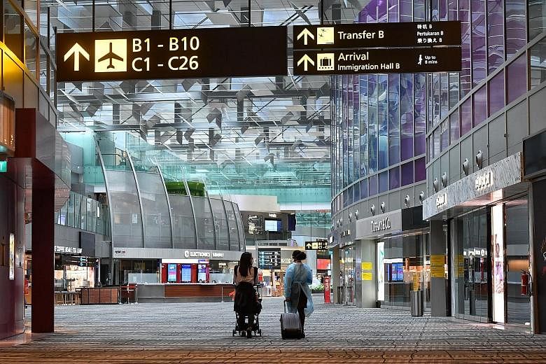 The departure hall at Changi Airport's Terminal 3 last month. Finance Minister Lawrence Wong, co-chair of the multi-ministry task force tackling Covid-19, said that in the near future, Singapore will begin reopening its borders for vaccinated people 