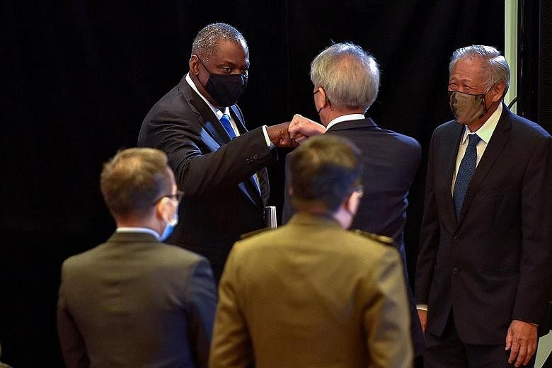 Left: US Secretary of Defence Lloyd Austin with Mr James Crabtree, executive director of IISS-Asia, at the 40th International Institute for Strategic Studies Fullerton Lecture held in Singapore yesterday. PHOTO: AGENCE FRANCE-PRESSE Above: Mr Austin 