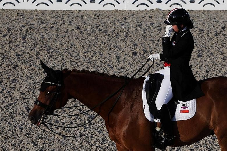 Caroline Chew on her horse Tribiani during the Olympic dressage on Sunday. She was eliminated after Tribiani was discovered to be bleeding from its lower lip.