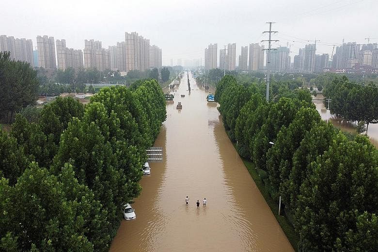 An aerial view of a flooded road following heavy rainfall in Zhengzhou in Henan, China, on July 23. China is hoping to improve its weather forecasts and warning systems.