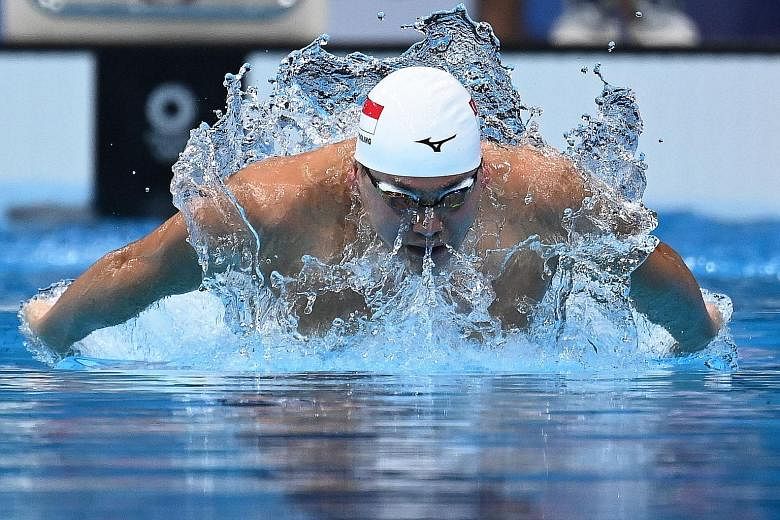 Joseph Schooling competing in a heat in the men's 100m butterfly swimming event at the Tokyo Aquatics Centre on Thursday. He clocked 53.12 seconds to finish last, and placed 44th out of the field of 55. PHOTO: AGENCE FRANCE-PRESSE Joseph Schooling sh