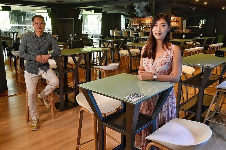 Mr Charlie Teo, director of 8 Degree Lounge, a chain of family-style karaoke outlets, and Ms Jolin Goh, its marketing manager, in their outlet at Orchid Country Club. The chain already has CCTV cameras covering every angle of the main halls at its ou