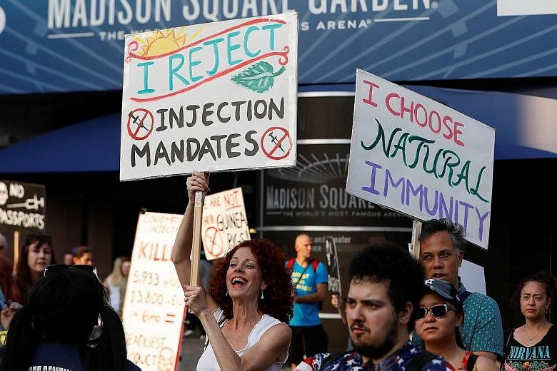 Anti-vaccine protesters outside Madison Square Garden ahead of a show by rock band Foo Fighters, which required proof of vaccination to enter, in New York City in June.