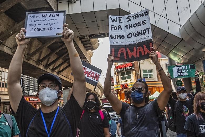 Protesters rallying in Kuala Lumpur yesterday as they called for Prime Minister Muhyiddin Yassin to step down and criticised the Malaysian government's handling of the pandemic. The protest organisers also called for a full parliamentary sitting and 