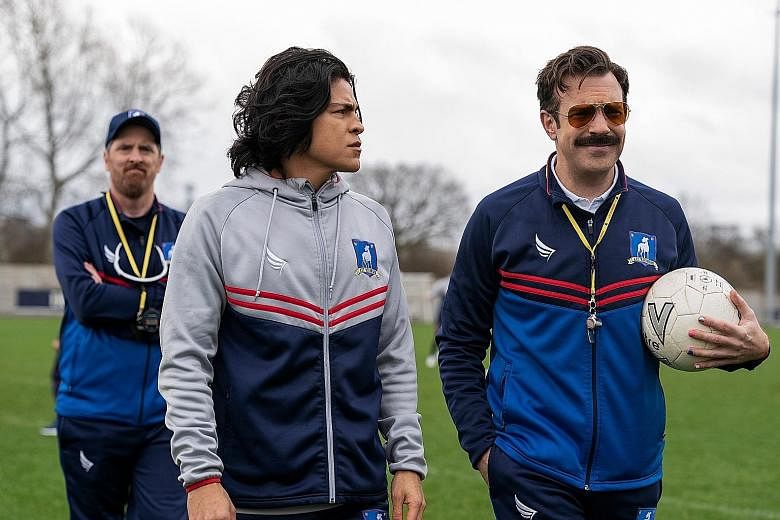 Ted Lasso, about a small-time American football coach who was hired to coach an English Premier League team, stars (from far left) Brendan Hunt, Cristo Fernandez and Jason Sudeikis.