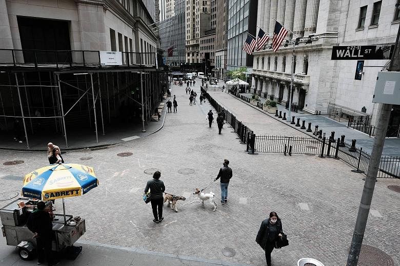 The New York Stock Exchange (right) in Wall Street. The distinctive aspect of the United States, says the writer, is that the rest of the world has been willing to absorb massive amounts of its debt (and equities) for decades. This allows the country