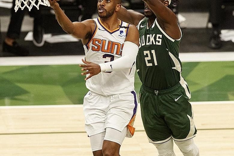 Above: Chris Paul (in white), who led Phoenix to the NBA Finals where they lost 4-2 to the Milwaukee Bucks, is extending his tenure with the Suns. But Kyle Lowry (far left) and Lonzo Ball (left) are moving to the Miami Heat and the Chicago Bulls resp