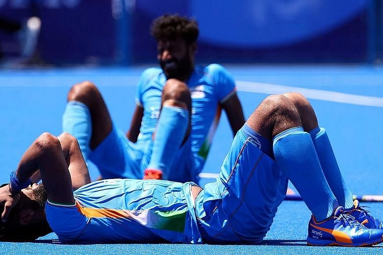 Defender Rupinder Pal Singh is a picture of disappointment after eight-time winners India lose 5-2 to Belgium in the Olympics hockey semi-finals.