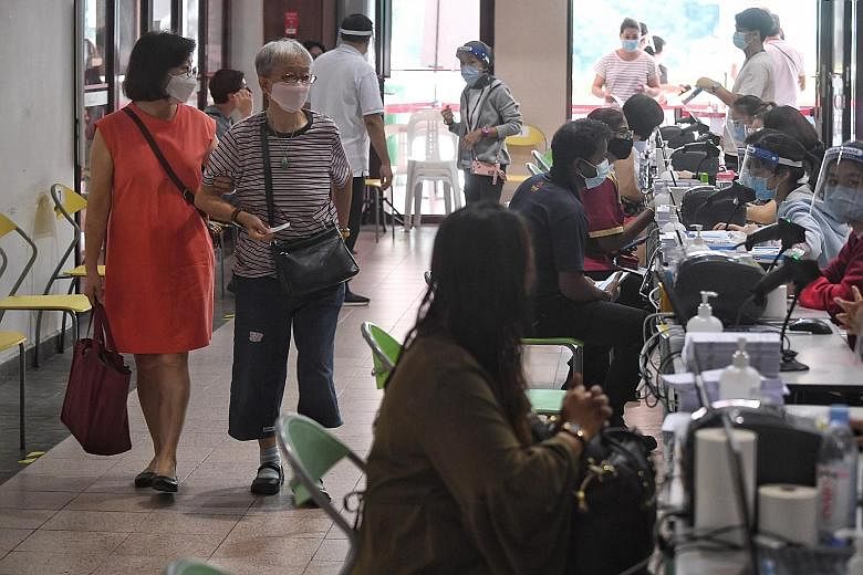 People at the vaccination centre at Tanjong Pagar Community Club in June. Last month, Health Minister Ong Ye Kung said booster shots for the Covid-19 vaccine may begin around next February, and may be needed to better fight against new variants that 