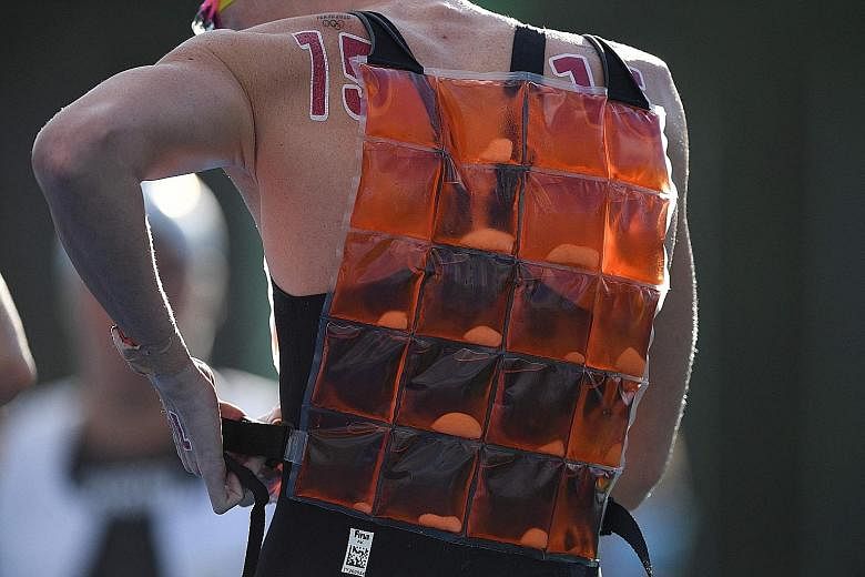 Top (from left): Estonian decathlete Maicel Uibo using an ice block to cool down; Polish pole vaulter Robert Sobera putting on an ice vest; and Serbia's Novak Djokovic resorting to ice and an air conditioner during his third-round tennis match. Above