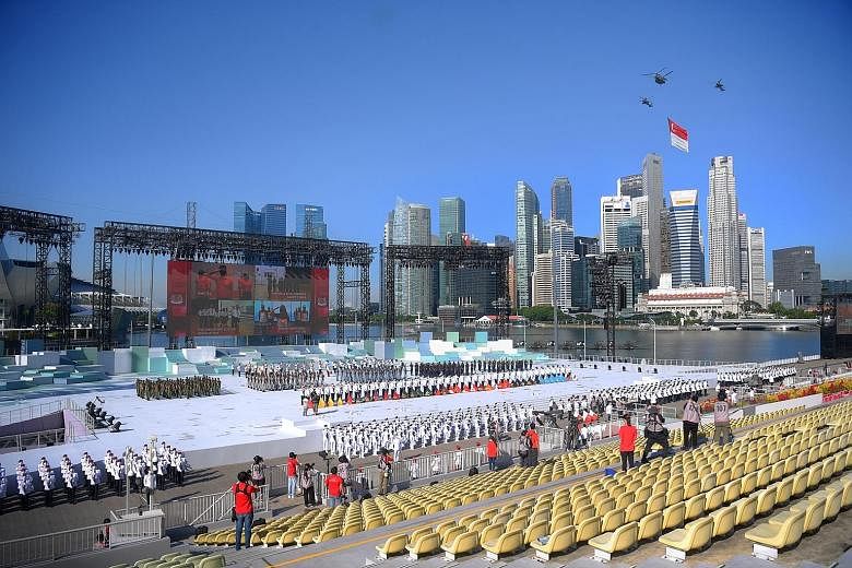 The state flag fly-past yesterday during the National Day ceremonial parade at the Marina Bay floating platform. The pandemic meant there were only 100 spectators, including front-liners, community volunteers and Cabinet ministers.