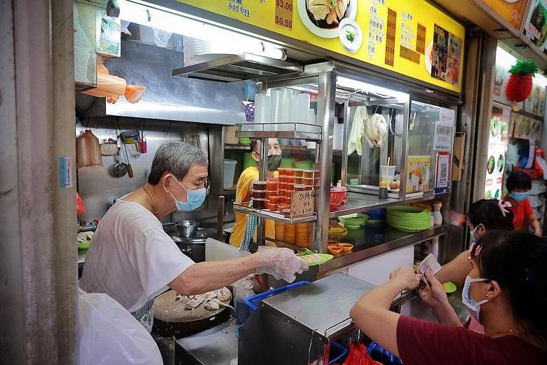 Soh Kee Cooked Food (left) at Jurong West 505 Market and Food Centre is also on the list this year. Fei Fei Roasted Noodle's (from far left) Mr Chan Wei Jie, Madam Jenny Yeong, Mr Chan Fook Kee and Ms Chan Shi Min at their food stall, which is on the