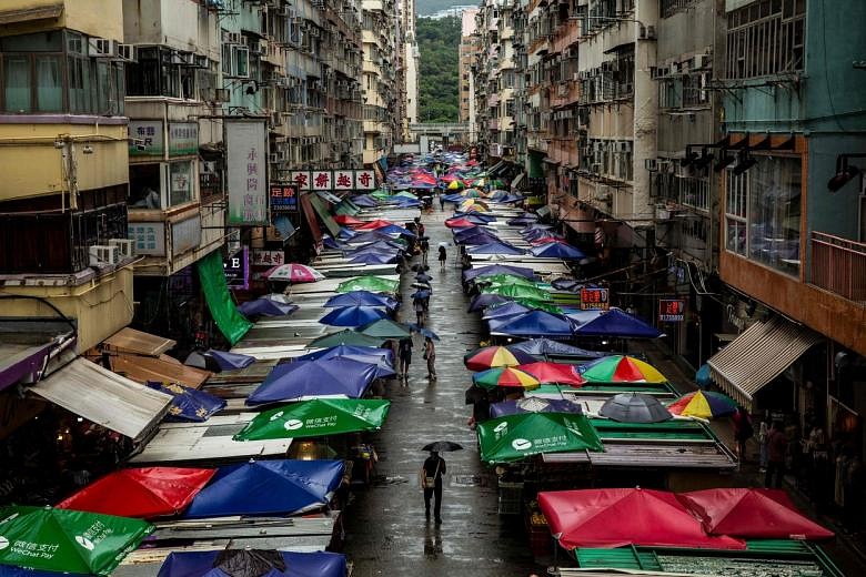 Businesses in Hong Kong slam tightened Covid-19 travel curbs | The ...