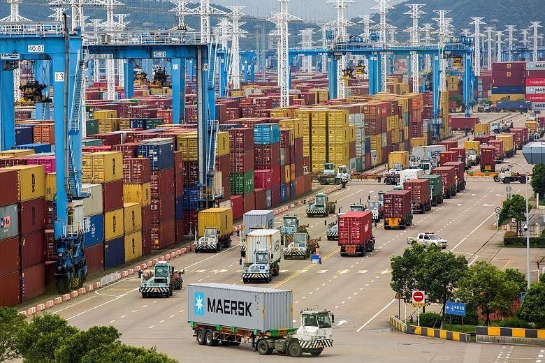 A container terminal at Ningbo port in Zhejiang province. Over 50 container vessels were queueing on Tuesday at Ningbo port - China's second-largest marine centre - up from 28 on Aug 10 when a Covid-19 case was reported at one of its terminals, accor