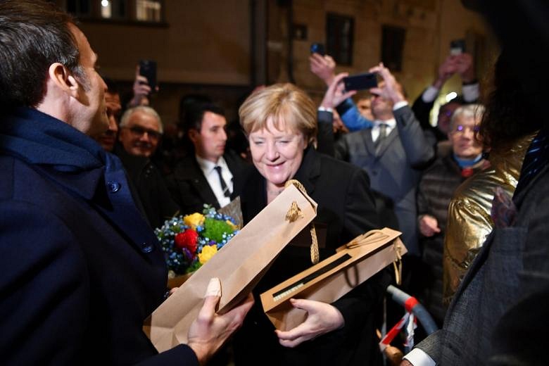 'France Loves You': Macron Bids Farewell To Germany's Angela Merkel ...