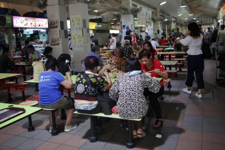 Buzz returns as hawker centres, coffee shops open to groups of 5 from