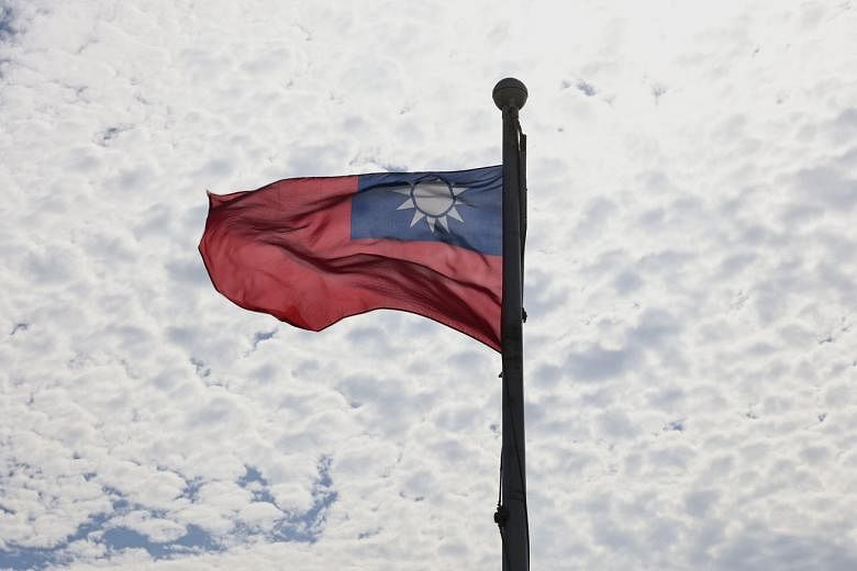 <p>FILE PHOTO: A Taiwanese flag flaps in the wind in Taoyuan, Taiwan, June 30, 2021. REUTERS/Ann Wang/File Photo</p>