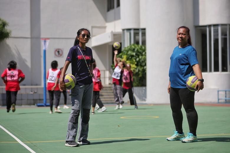 For Causes Week 2021. Siti Hajar Haron (in blue top), 51, Fatin Nurdiyana (in purple top), 23, two netball coaches from Netball Singapore, conducting a free netball programme for the Pertapis Centre for Women and Girls on Dec 1, 2021.