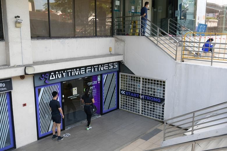 A patron entering the Anytime Fitness gym in Bukit Timah on Dec 21, 2021.