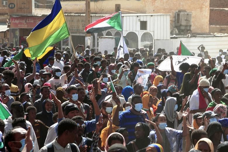 Protesters marching during a mass demonstration in the Sahafa neighbourhood in Khartoum, Sudan, on Dec 25, 2021.