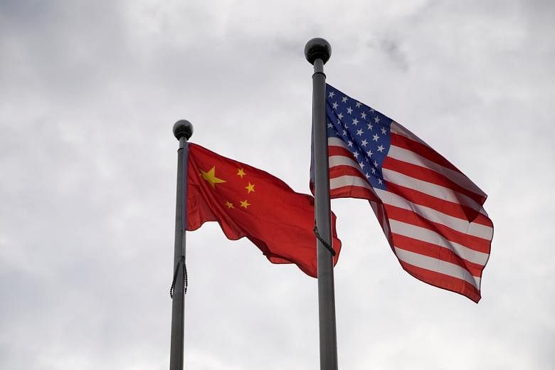 <p>Chinese and U.S. flags flutter outside a company building in Shanghai, China November 16, 2021. REUTERS/Aly Song</p>