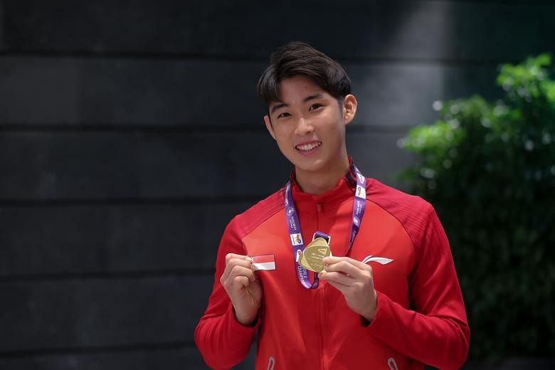 Singaporean shuttler Loh Kean Yew at a press conference after arriving to Changi Airport Terminal 1, 21 Dec 2021.