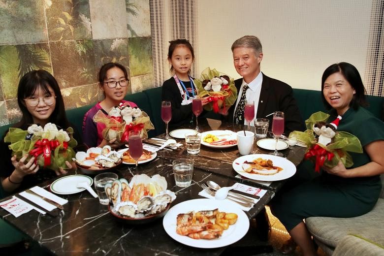 <p>ST20211228_202112848635 : Gin Tay / ssfund28-ol/29 / Siti Sarah</p><p>Festive lunch treat by Orchard Hotel for The Straits Times School Pocket Money Fund (STSPMF ) beneficiaries , (L-R) Lim Zhi Yi Jade, 15; Pang Jing Han, 17; and Pang Jing Wen, 9; wit
