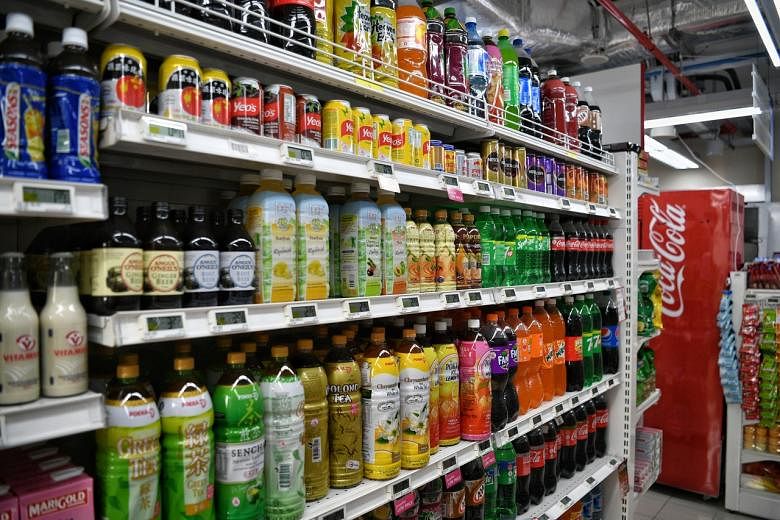<p>A shelf of bottled and canned drinks sold at a supermarket in Macpherson on 10 March 2020.</p>