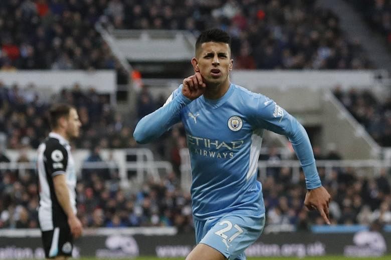 <p>Soccer Football - Premier League - Newcastle United v Manchester City - St James' Park, Newcastle, Britain - December 19, 2021Manchester City's Joao Cancelo celebrates scoring their second goal Action Images via Reuters/Lee Smith EDITORIAL USE ONLY. N