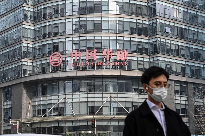 L’équipe de sauvetage de China Huarong touchée par une perte de papier de 5,6 milliards de dollars alors que le stock baisse