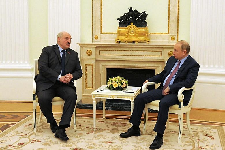 Putin hosts Belarus strongman for security talks, drills | The Straits ...