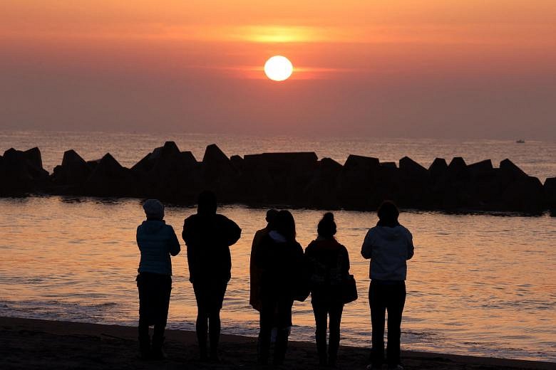 In pictures: Japan mourns the victims of the 2011 earthquake and tsunami |  Straits Times