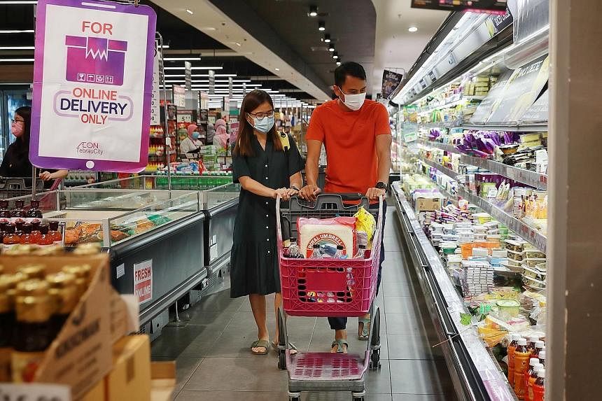 Shoppers at Aeon hypermarket in Tebrau, Johor Bahru . The Malaysian government has scrapped approved permits for a range of food items amid reports of shortages of essential items. ST FILE PHOTO