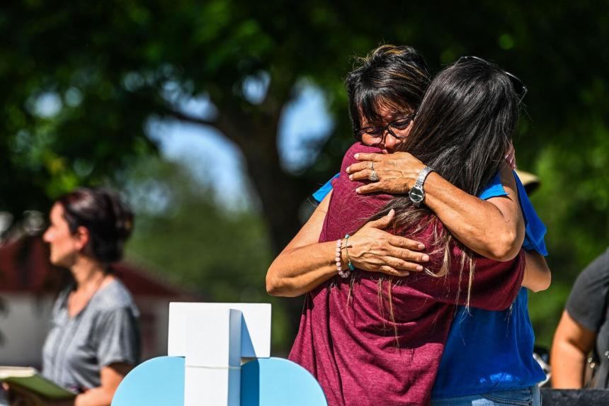 'Do something now' Mourners demand action after US school shooting The Straits Times