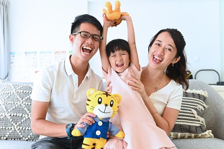 Mr Benjamin Yeo with his wife and daughter