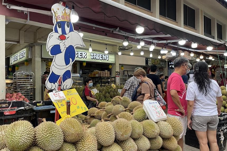 Bumper harvest, cheap durians see fans queueing at stalls across Singapore