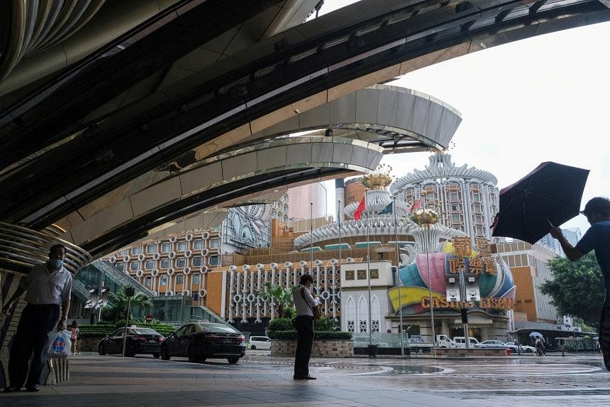 Macau shuts all its casinos to curb Covid-19, gaming shares plunge