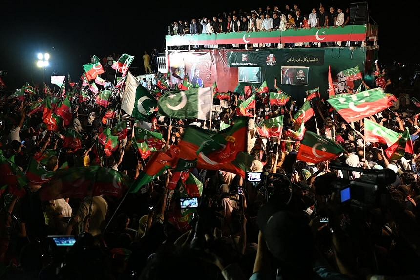 Supporters Gather At Home Of Pakistan's Former PM Khan, Aiming To Foil ...