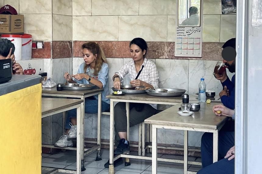Iran arrests woman for eating out without hijab: Sister