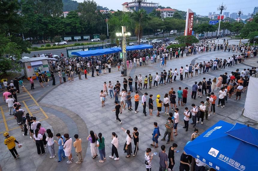 China's Covid-19 cases hit one-month high as holiday spots flare