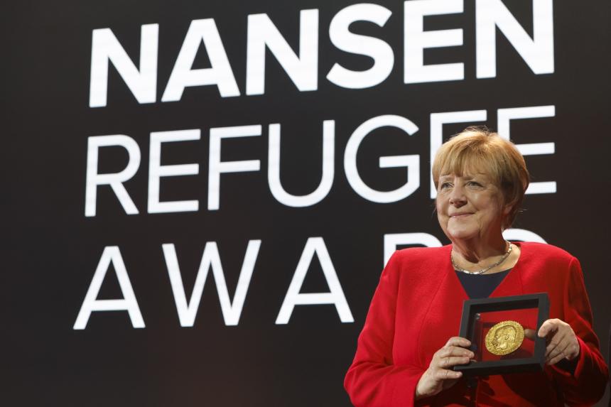 Respect refugee rights Angela Merkel tells leaders as she accepts UN