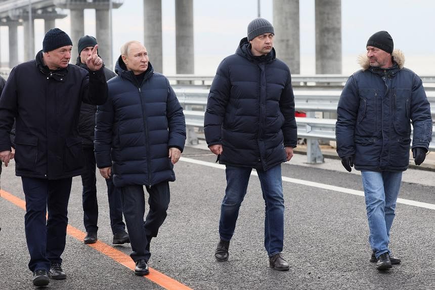 Putin visits the newly fixed Crimean bridge for the first time since the October blast