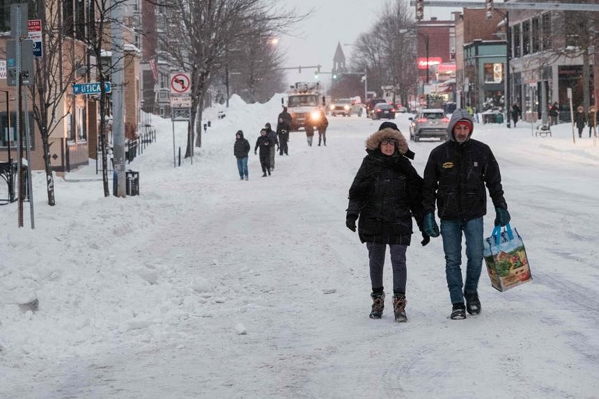 Slushy snow tapering but more Tuesday; January temps later this week