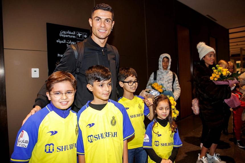 Ronaldo poses with Al Nassr shirt after signing for Saudi club